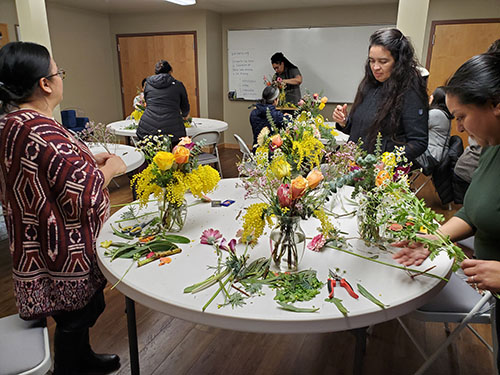 2024 Floral Class, ladies working on and showing their beautiful floral arrangements.