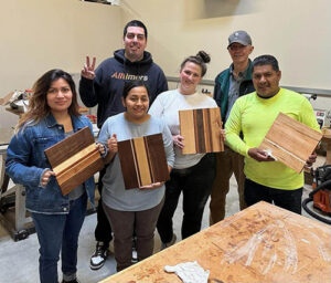 Proud Woodshop Adventure group with finished cutting boards