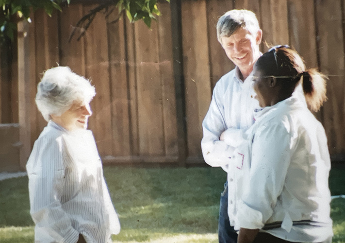 Dick and Sue Jacobsen (founders) talking happily with a woman