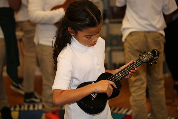 Girl learning ukulele